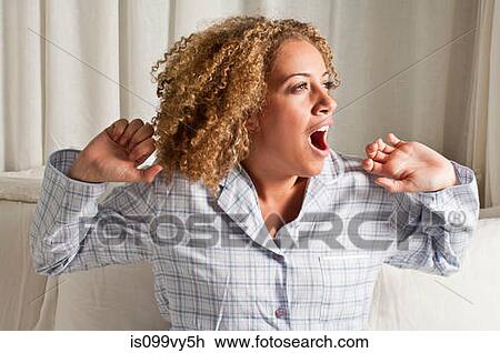 Woman stretching and yawning View Large Photo Image Stock Image - Woman stretching and yawning. Fotosearch