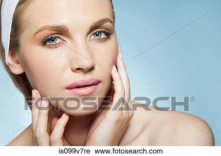 Woman touching face View Large Photo Image Stock Image - Woman touching face. Fotosearch