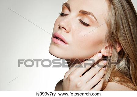 Woman touching skin View Large Photo Image Stock Photo - Woman touching skin. Fotosearch