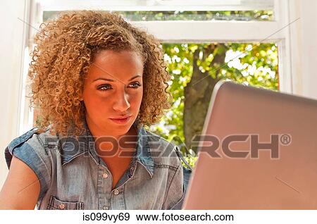 Woman using laptop View Large Photo Image Stock Photo - Woman using laptop. Fotosearch