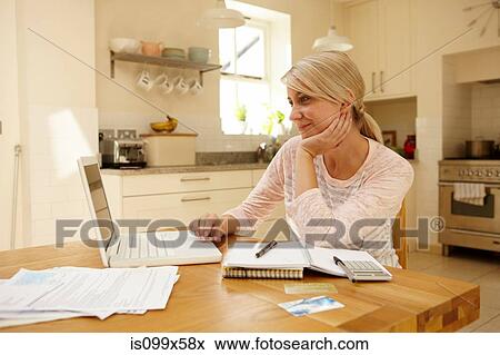 Woman using laptop View Large Photo Image Stock Photo - Woman using laptop. Fotosearch