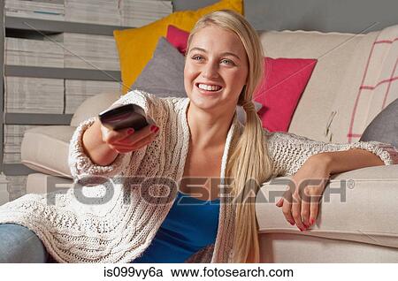 Stock Image - Woman watching television. Fotosearch