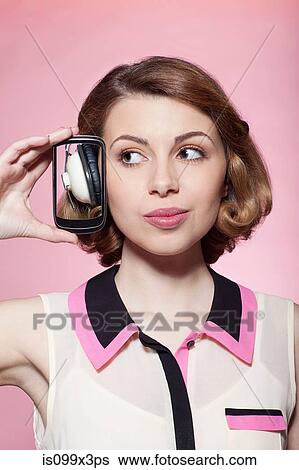 Stock Photograph - Woman wearing headphones. Fotosearch