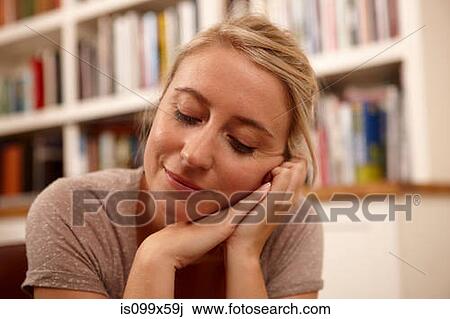 Woman with eyes closed and hand on chin View Large Photo Image Stock Image - Woman with eyes closed and hand on chin. Fotosearch