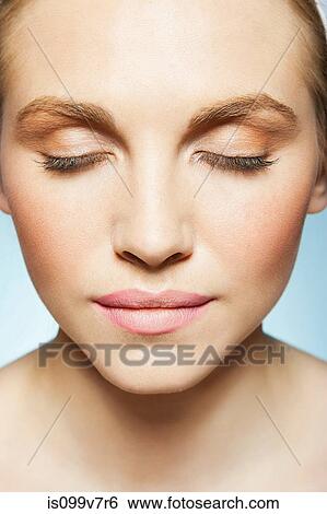 Stock Photograph - Woman with eyes closed. Fotosearch