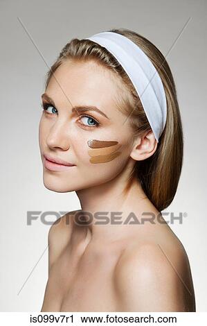 Woman with stripes of foundation on cheek View Large Photo Image Stock Image - Woman with stripes of foundation on cheek. Fotosearch