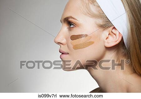 Woman with stripes of foundation on cheek View Large Photo Image Stock Image - Woman with stripes of foundation on cheek. Fotosearch