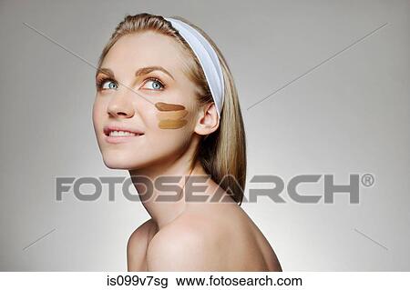 Woman with stripes of foundation on cheek View Large Photo Image Stock Image - Woman with stripes of foundation on cheek. Fotosearch