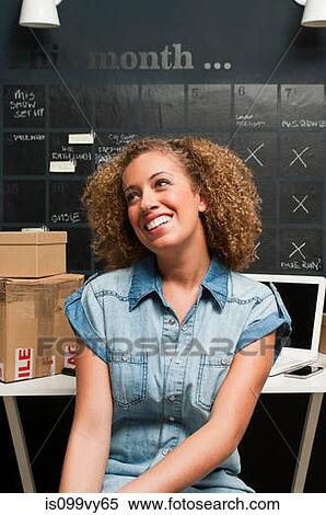 Stock Photography - Woman working from home. Fotosearch