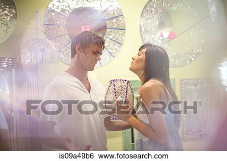 Stock Photograph - Arguing couple shopping in store. Fotosearch