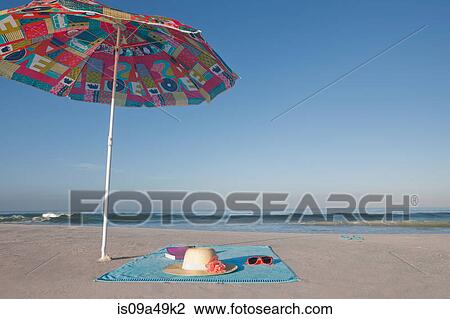 Blanket and towel on empty beach View Large Photo Image Stock Image - Blanket and towel on empty beach. Fotosearch