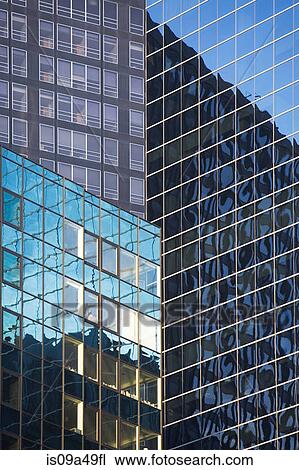 Stock Image - Buildings reflected in urban skyscrapers. Fotosearch