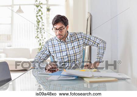 Businessman at work in kitchen View Large Photo Image Picture - Businessman at work in kitchen. Fotosearch