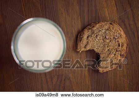 Chocolate chip cookie with milk View Large Photo Image Stock Photo - Chocolate chip cookie with milk. Fotosearch