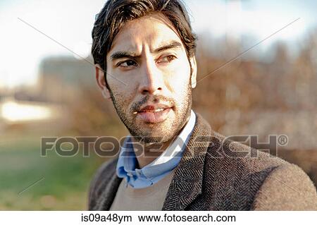 Picture - Close up of man's serious face. Fotosearch