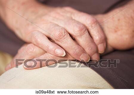 Stock Photograph - Close up of older woman's hands. Fotosearch