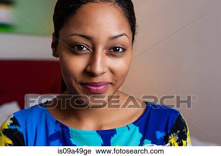Stock Image - Close up of smiling woman's face. Fotosearch
