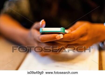 Close up of woman using cell phone View Large Photo Image Stock Photo - Close up of woman using cell phone. Fotosearch