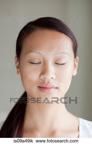 Close up of woman with eyes closed View Large Photo Image Stock Image - Close up of woman with eyes closed. Fotosearch