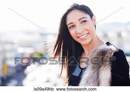 Stock Image - Close up of woman's smiling face. Fotosearch