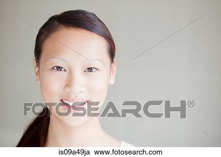 Close up of woman's smiling face View Large Photo Image Stock Image - Close up of woman's smiling face. Fotosearch