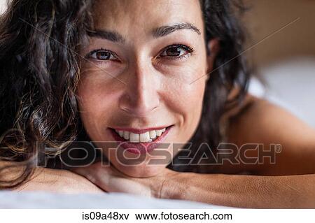 Stock Photo - Close up of woman's smiling face. Fotosearch