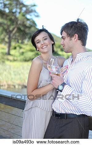Couple drinking wine together outdoors View Large Photo Image Picture - Couple drinking wine together outdoors. Fotosearch