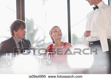 Couple having dinner at restaurant View Large Photo Image Stock Photography - Couple having dinner at restaurant. Fotosearch
