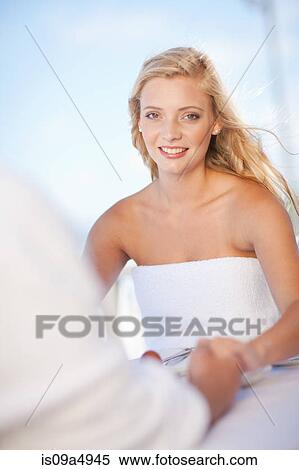 Stock Photography - Couple holding hands at table. Fotosearch