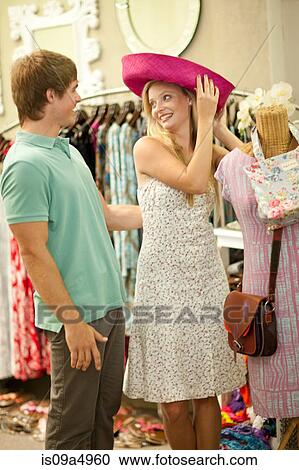 Couple shopping together in store View Large Photo Image Stock Image - Couple shopping together in store. Fotosearch