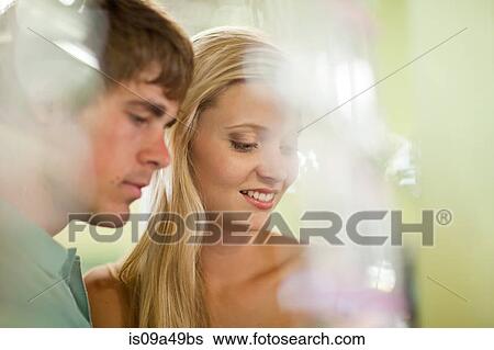 Stock Photograph - Couple shopping together in store. Fotosearch