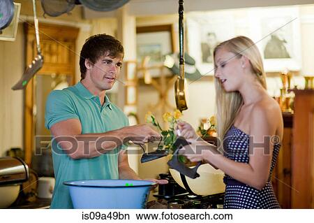 Couple shopping together in thrift store View Large Photo Image Picture - Couple shopping together in thrift store. Fotosearch