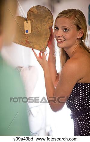 Couple shopping together in thrift store View Large Photo Image Stock Image - Couple shopping together in thrift store. Fotosearch