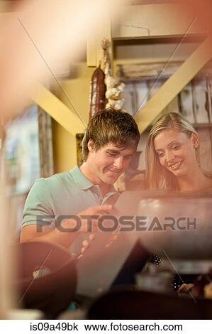 Couple shopping together in thrift store View Large Photo Image Stock Image - Couple shopping together in thrift store. Fotosearch