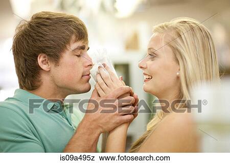 Couple smelling candles in store View Large Photo Image Stock Photo - Couple smelling candles in store. Fotosearch