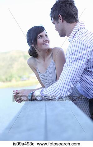 Stock Image - Couple smiling together outdoors. Fotosearch