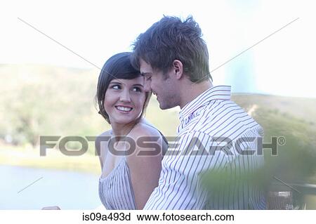 Couple smiling together outdoors View Large Photo Image Stock Image - Couple smiling together outdoors. Fotosearch