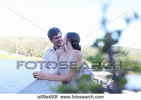 Stock Image - Couple smiling together outdoors. Fotosearch