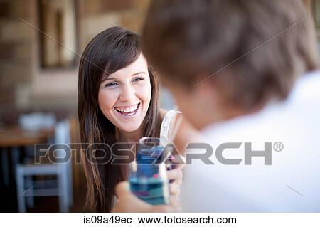 Couple toasting with cocktails View Large Photo Image Stock Image - Couple toasting with cocktails. Fotosearch