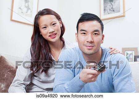 Stock Image - Couple watching television together. Fotosearch