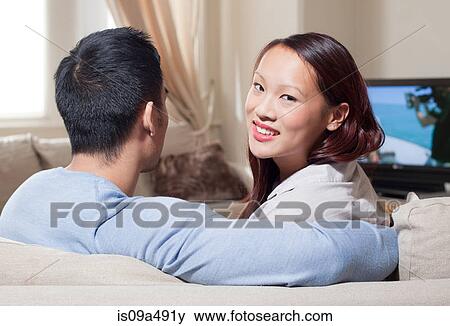 Stock Photo - Couple watching television together. Fotosearch