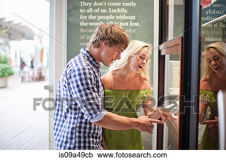 Couple window shopping for jewelry View Large Photo Image Stock Image - Couple window shopping for jewelry. Fotosearch