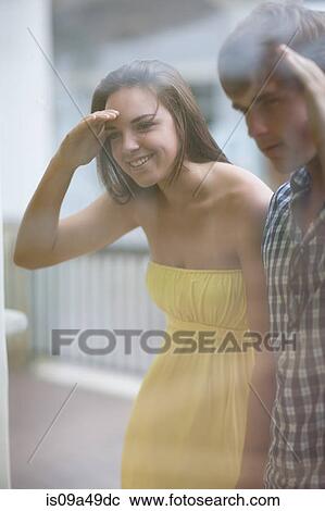 Stock Image - Couple window shopping together. Fotosearch