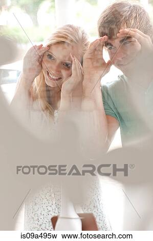 Stock Photo - Couple window shopping together. Fotosearch