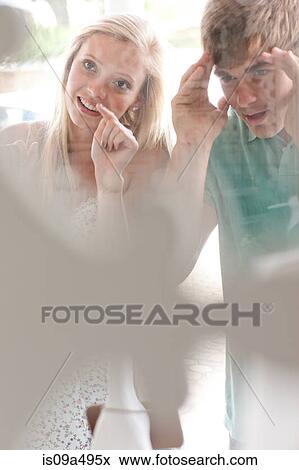Stock Photo - Couple window shopping together. Fotosearch