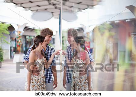 Stock Photo - Couple window shopping together. Fotosearch