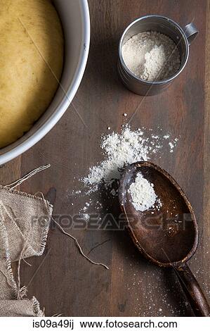Dough, flour and wooden spoon View Large Photo Image Stock Image - Dough, flour and wooden spoon. Fotosearch