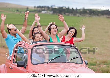 Friends cheering in convertible View Large Photo Image Picture - Friends cheering in convertible. Fotosearch