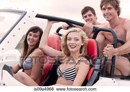 Stock Photo - Friends driving in jeep. Fotosearch