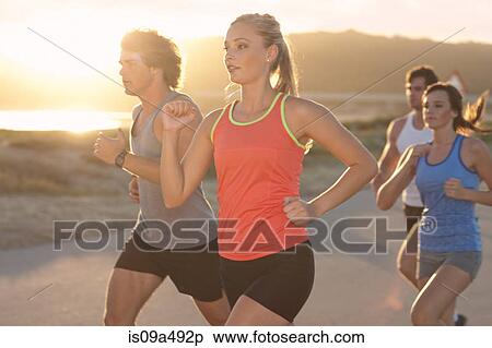 Friends running on beach View Large Photo Image Stock Photography - Friends running on beach. Fotosearch